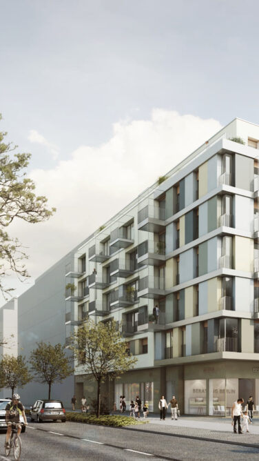 Moderne Mehrparteienhäuser mit großen Glasfenstern und viel Grün.